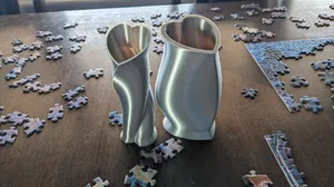 Two valentines themed heart shaped vases.