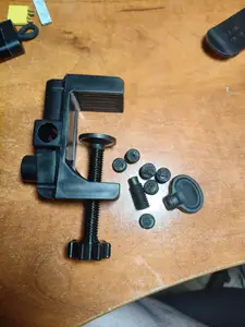Screw - repair part for a lamp on a clamp.