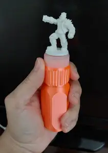 Miniature Painting Handle with rotating bearing and threads for bottle caps.