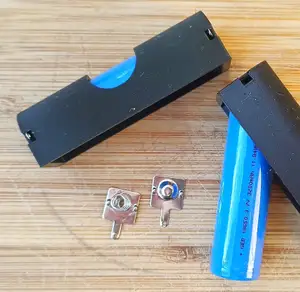 18650 Single Li-Ion Cell Cradle with metallic AA battery contacts -- stand-alone and built-in version