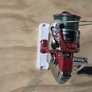 Wall mounted reel holder