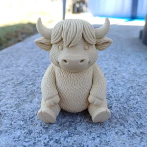 Little fluffy horned cow