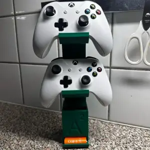 Controller stand with battery dispenser
