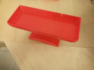 Holder for headphones with storage tray
