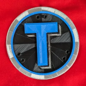T Letter Badge - Embossed
