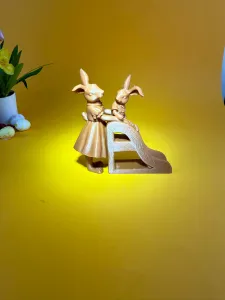 A family of rabbits on a slide