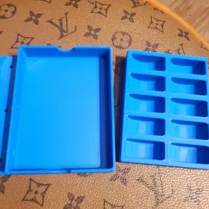 Sewing bobbin caddy. Screw mounts to the side of table. Sz U