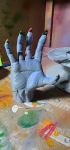 devil hand reaching out