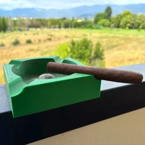 Ashtray with cigar holder and pipe emptyer