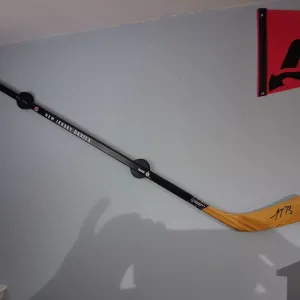 Hockey Puck Stick Holder