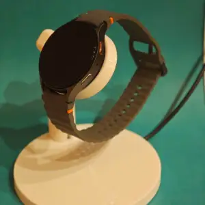 Samsung Galaxy Watch 7 stand with charger