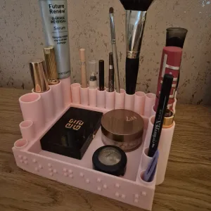 makeup storage "gorgeous" in braille on the front panel