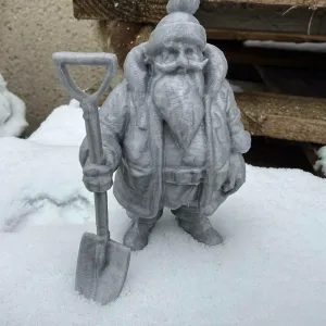Santa Claus with a snow shovel