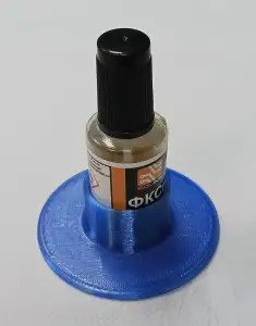 Round stand for a container with a flux.
