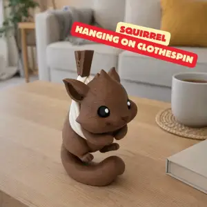 SQUIRREL HANGING ON A CLOTHESPIN