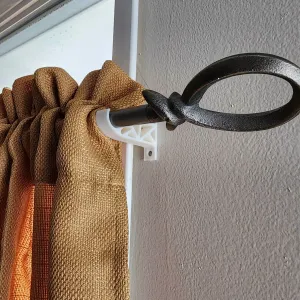 Curtain rod holder