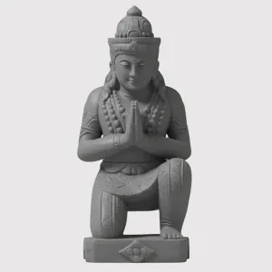 Estátua de uma divindade oriental em oração.