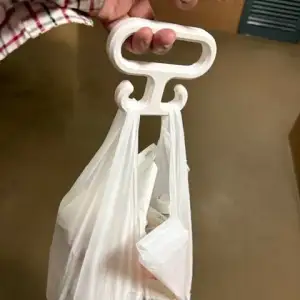 A hook that makes carrying plastic bags more comfortable.
