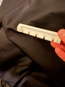 Wall-mountable cable holder
