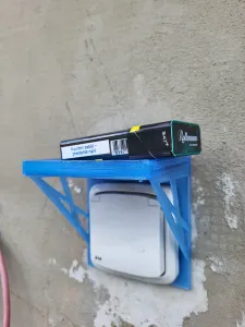 Power outlet protector and shelf 2in1