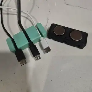 phone cable organizer with magnet holes on bottom