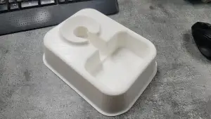 A plastic bottle Used pet waterer