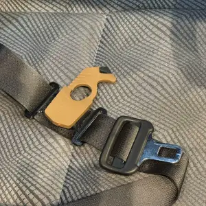 Seat belt cutter clip for seat belt and tactical molle