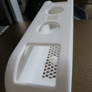 Electric toothbrush holder with removable grid