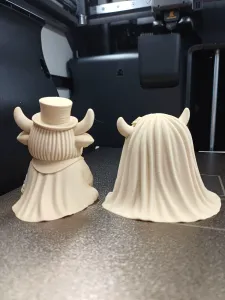 This charming Highland cow bride and groom set captures the