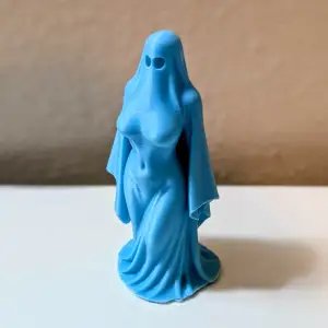 Haunting Elegance – Ghost Lady Figurine