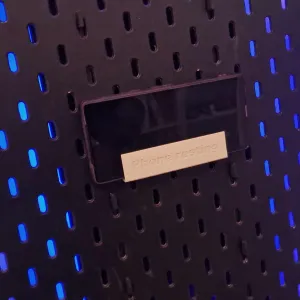 Phone holder (an 'Ikea Skadis Charger wall' module)