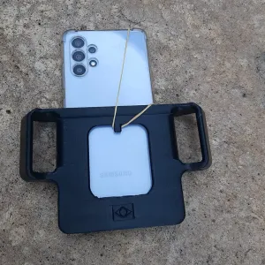 Cell phone holder for backpack