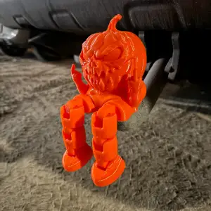 Tow hitch attachment, pumpkin shows middle finger