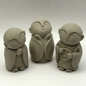 Three Monk Figurines