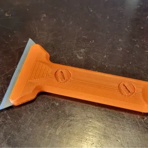 Scraper with repleaceble blades