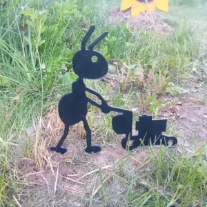 Garden figure of an ant with a lawn mower