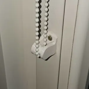 Blind chain tensioner