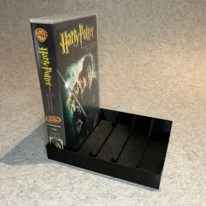 Stand holder for VHS cassettes