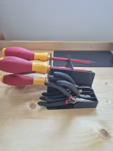 Holder for pliers and screwdrivers
