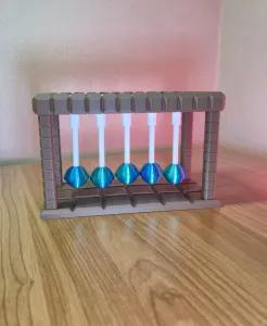 Lollipop Newton’s Cradle
