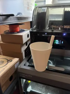 a cup for cold drinks with a straw