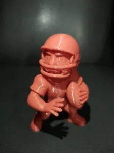 American Football Player with Helmet And Ball Figurine