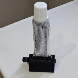 Presse dentifrice