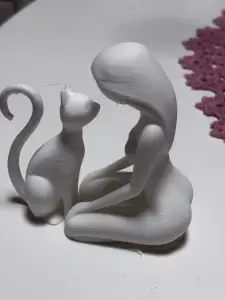 Woman and cat sculpture