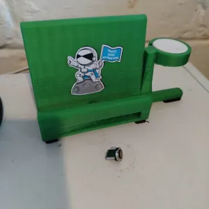 Magnetic tip phone stand with wireless watch charger