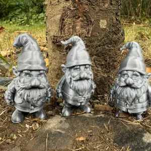3 garden gnomes, hobbits