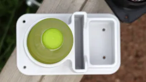 Cup and phone holder with a small storage tray for coins and