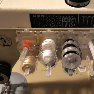 Bobbin holder grid for sewing