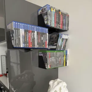 Lightweght console games/DVD/CD holder/shelf.