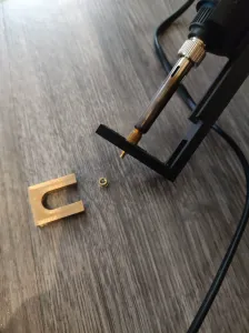 soldering iron stand with adjuster for melting inserts
